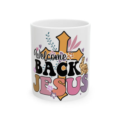 Mug with "Welcome Back Jesus" text and floral cross design.