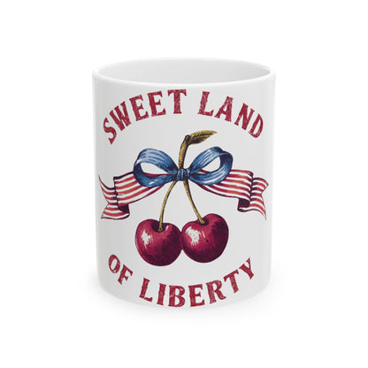 White mug with cherries, ribbon, and "Sweet Land of Liberty" text.