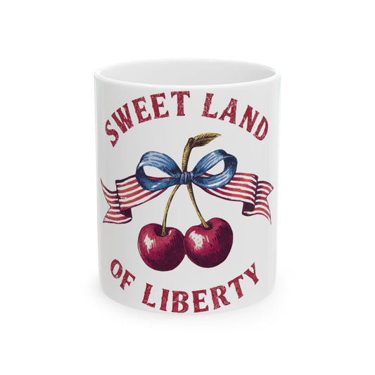 White mug with cherries, ribbon, and "Sweet Land of Liberty" text.