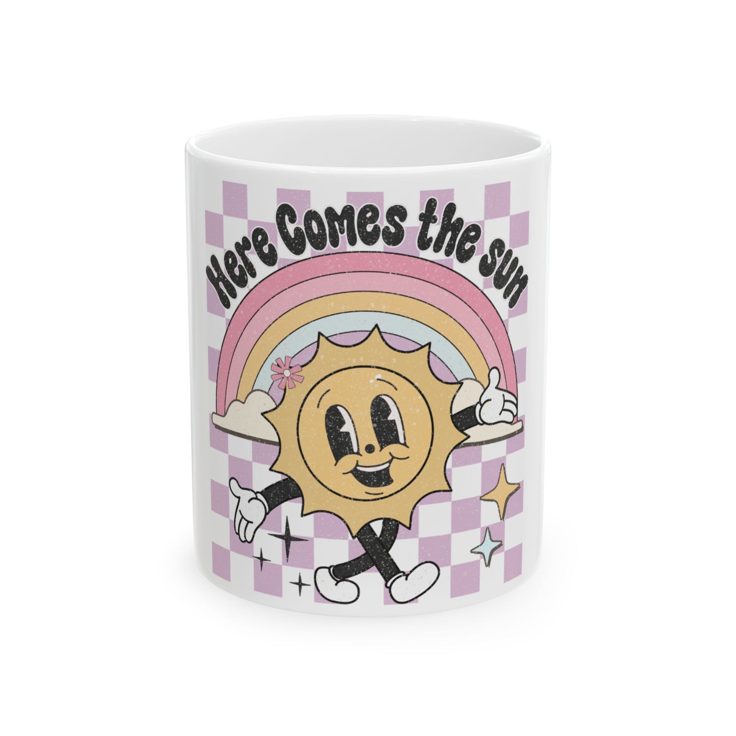 Mug with smiling sun, rainbow, and "Here Comes the Sun" text.