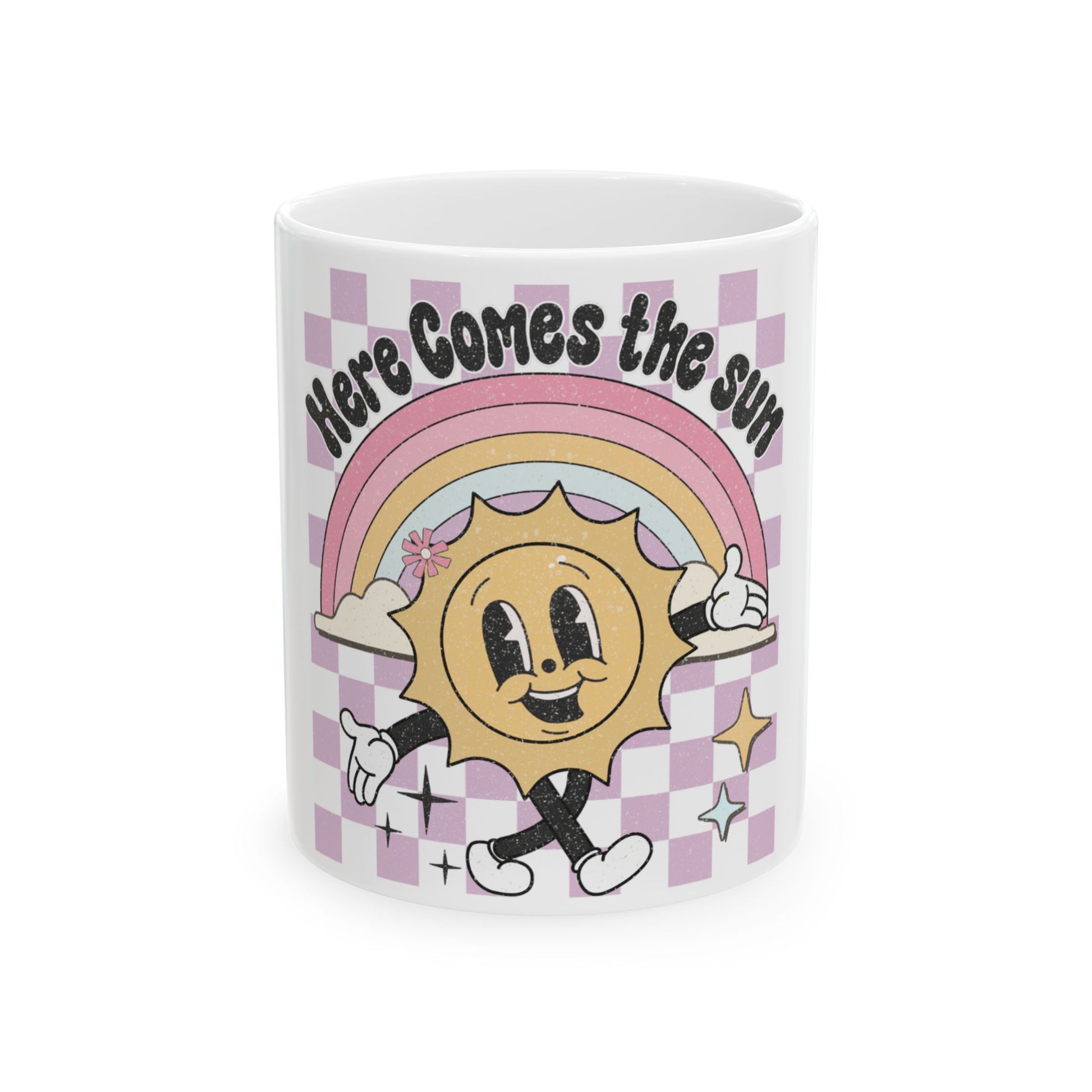 Mug with smiling sun, rainbow, and "Here Comes the Sun" text.