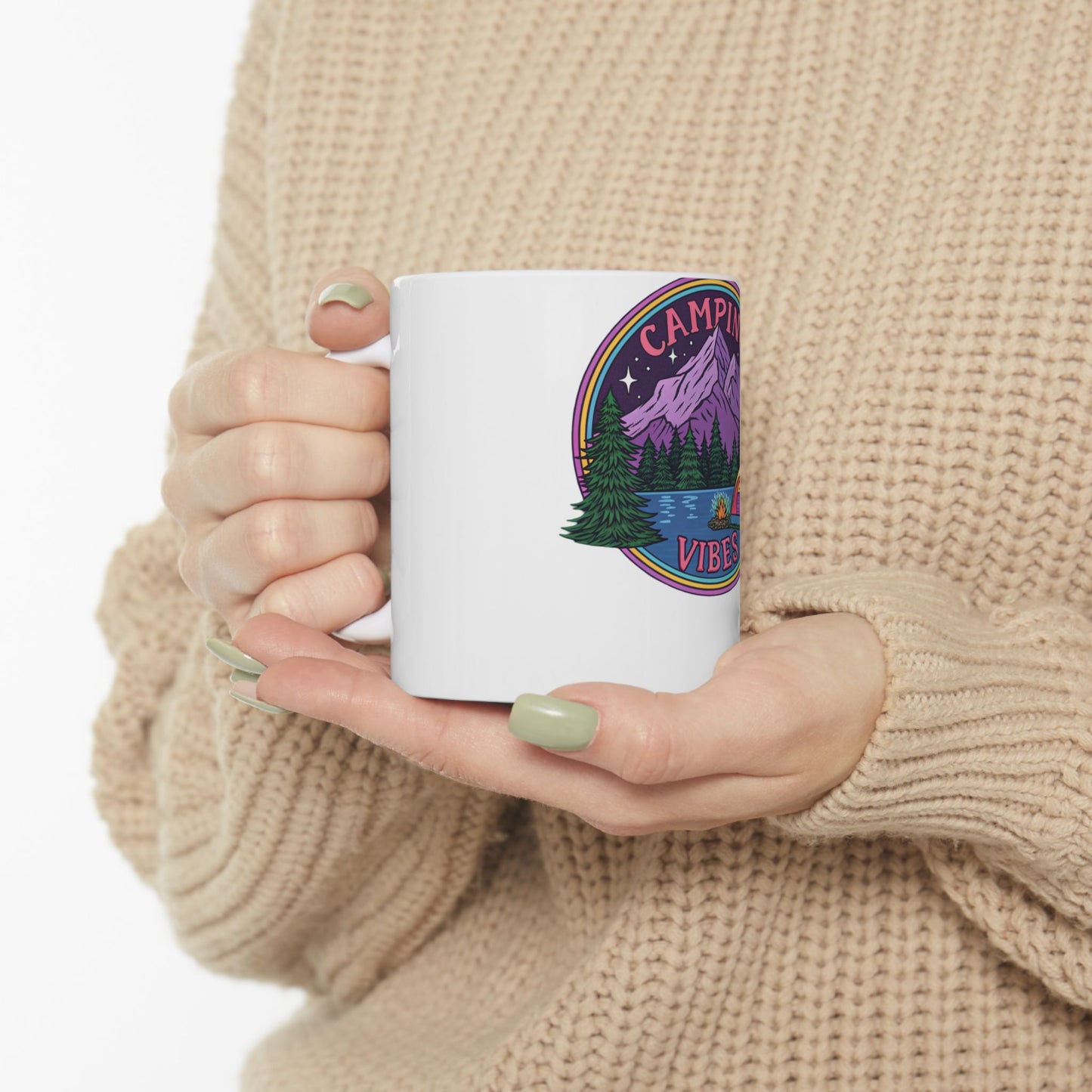 White mug with "Camping Vibes" text and a colorful mountain landscape design.