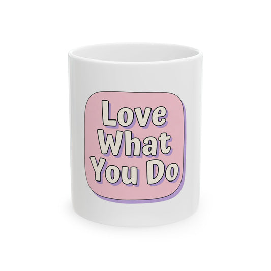 White mug with pink speech bubble saying "Love What You Do".