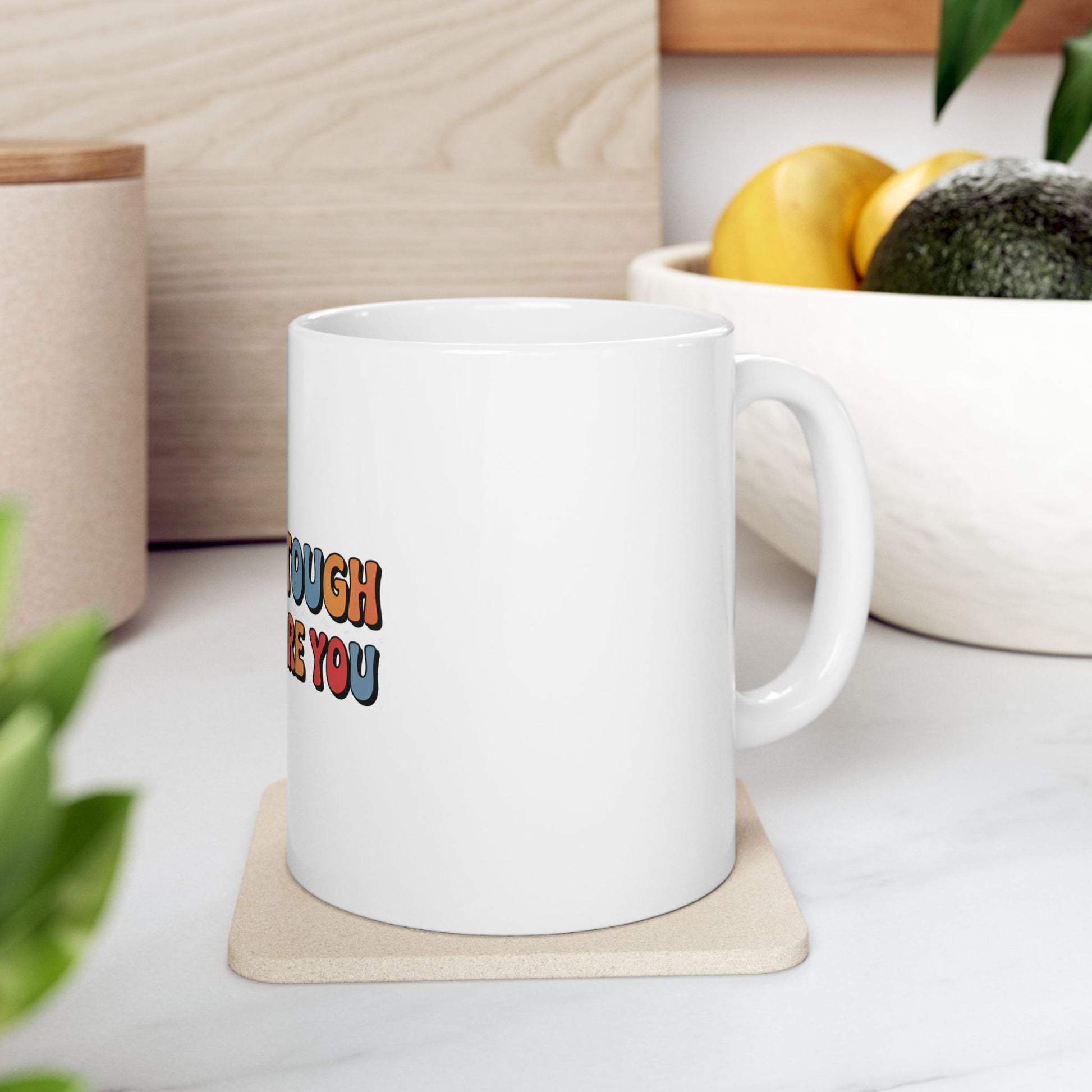 White mug with colorful text "enough tough for you".