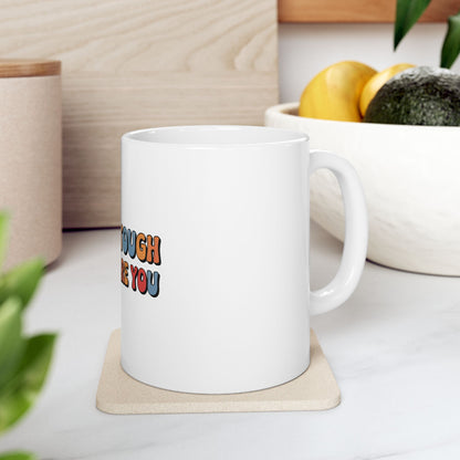 White mug with colorful text "enough tough for you".