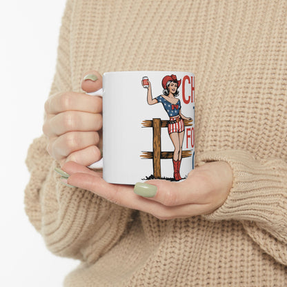 Woman in patriotic cowgirl outfit holding a mug with text and flag design.