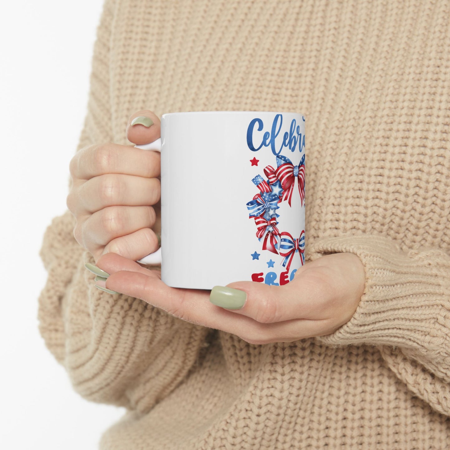 White mug with patriotic "Celebrate Freedom" text and ribbon design.