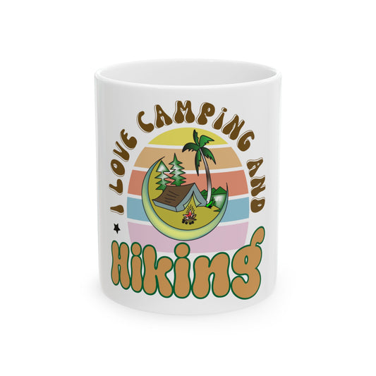 Mug with "I love camping and hiking" text and colorful camping scene.