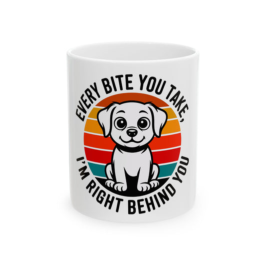 Mug with a cartoon dog and text: "Every bite you take, I'm right behind you."