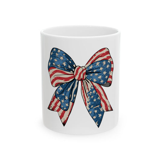 White mug featuring a red, white, and blue American flag bow design.