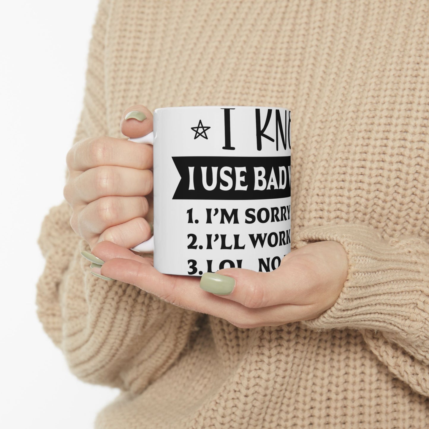 White mug with text "I USE BAD" and numbered list of apologies.