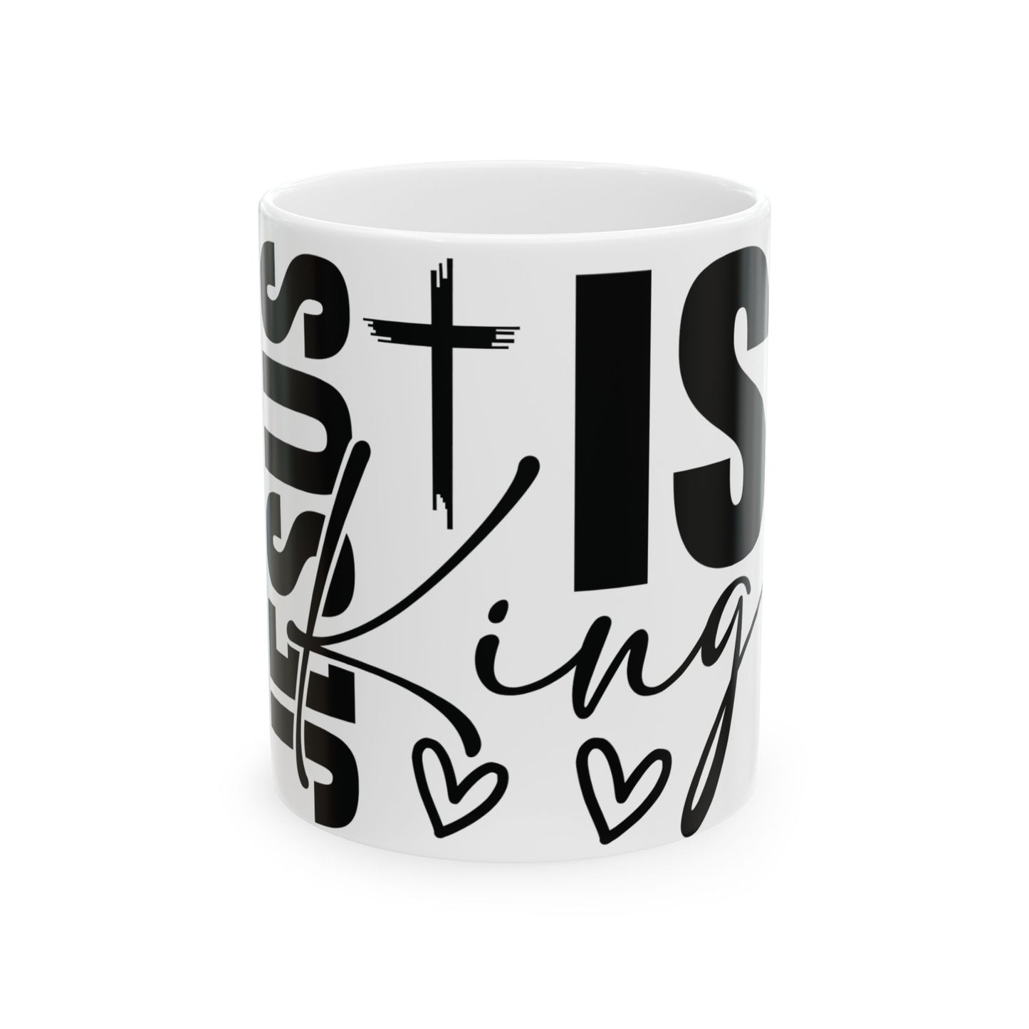 White mug with black text "Jesus is King" and small heart designs.