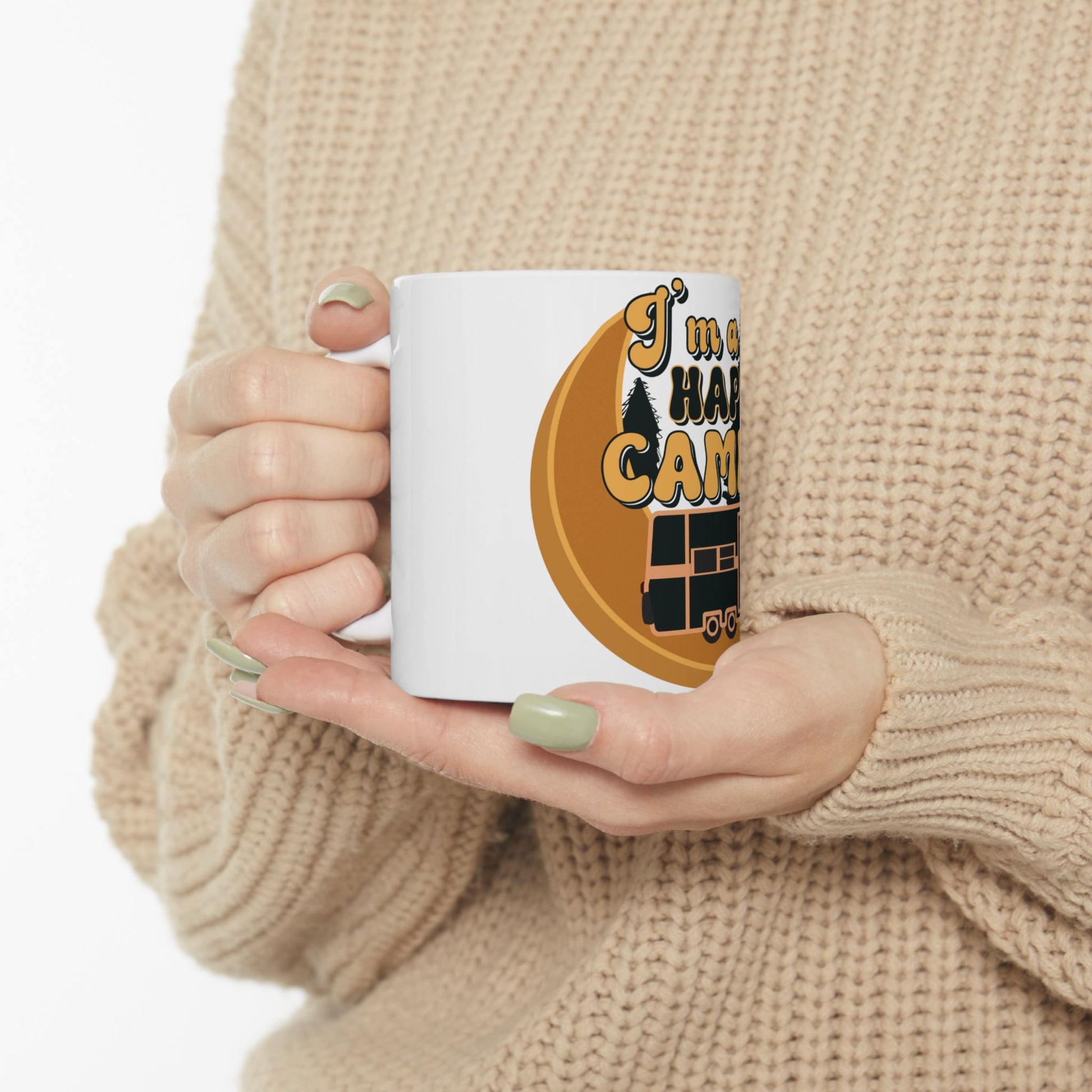 White mug with "I'm a happy camper" text and RV graphic.