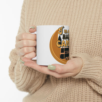 White mug with "I'm a happy camper" text and RV graphic.