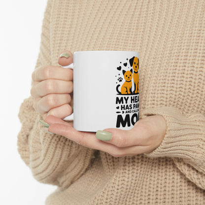White mug with "My heart has paws and calls me Mom" text and dog/cat graphic.