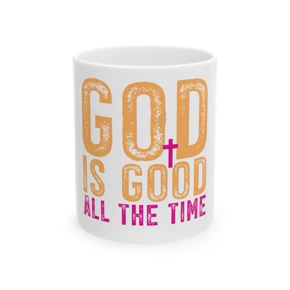 White mug with "GOD IS GOOD ALL THE TIME" text in orange and pink.