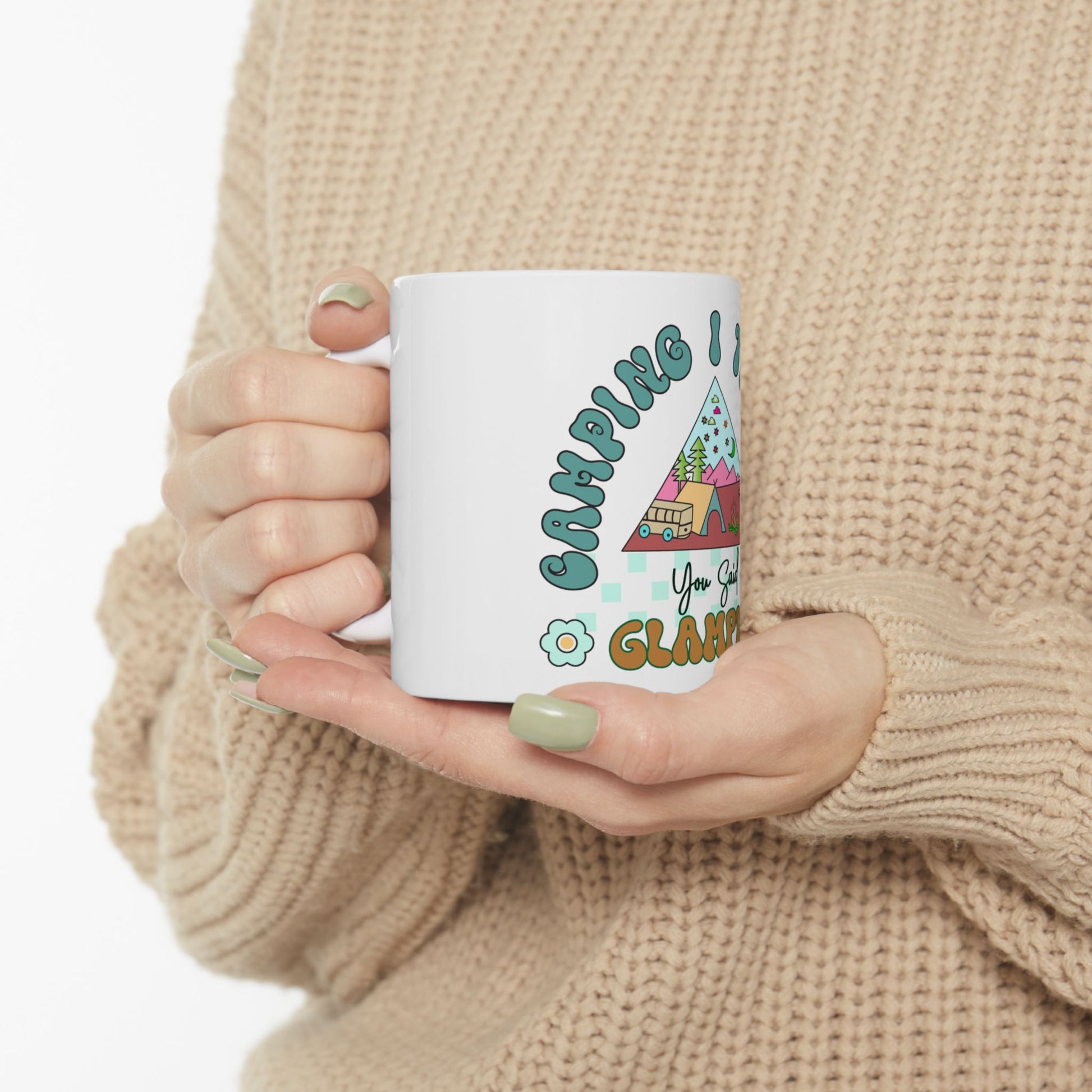 White mug with "Camping is my happy place" text and colorful camping illustrations.