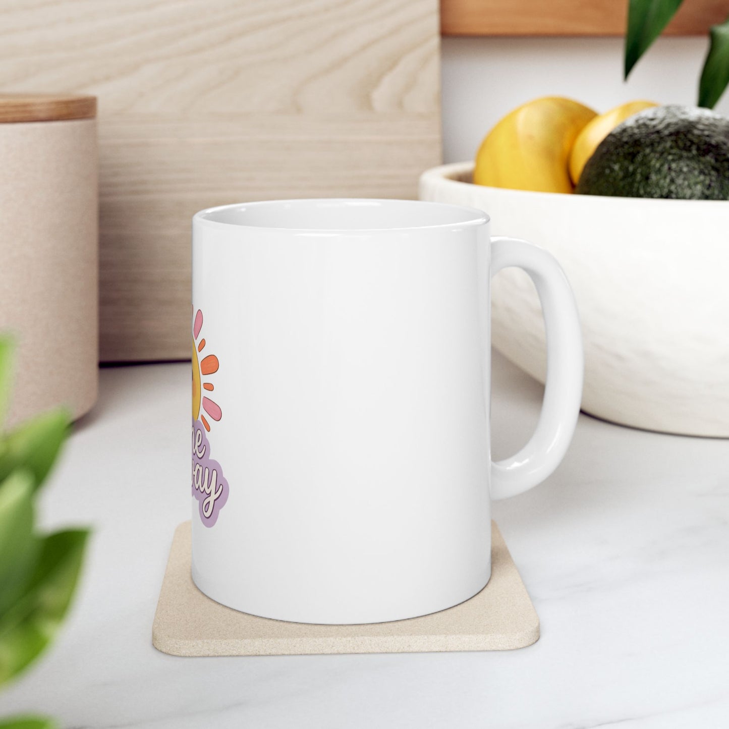 White mug with "Have a nice day" text and a sun graphic.