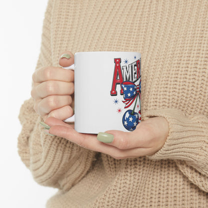 White mug with "AMERICA" text, cherry, and stars and stripes pattern.