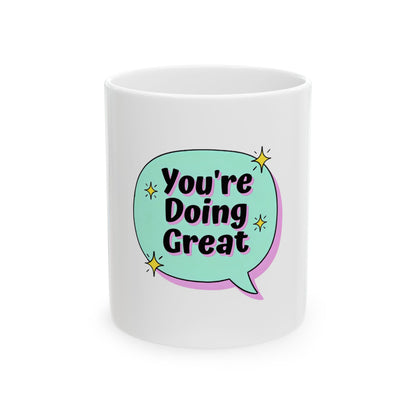 White mug with a blue speech bubble saying "You're Doing Great."