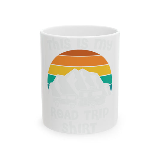 Mug with sunset, mountain, and RV graphic and text "ROAD TRIP SHIRT".