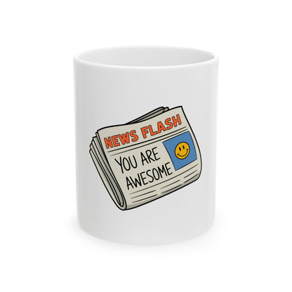 White mug with newspaper graphic reading "NEWS FLASH YOU ARE AWESOME".