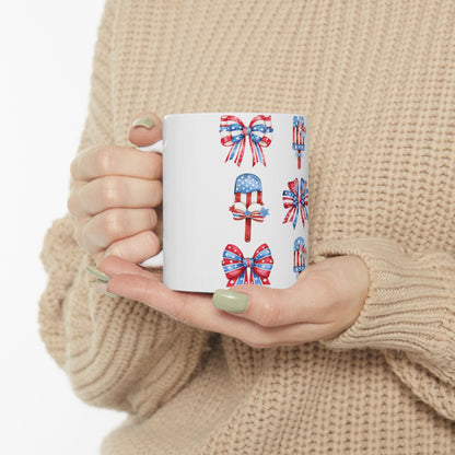 Mug with patriotic bows, popsicles, and stars pattern.