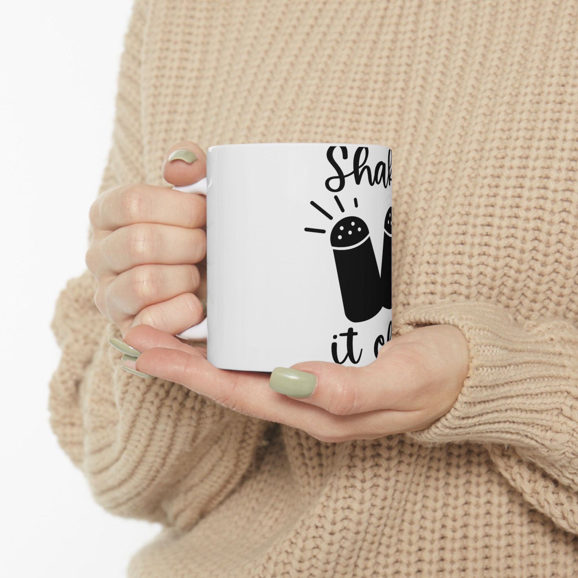 White mug with "Shake it up" text and salt and pepper shakers design.