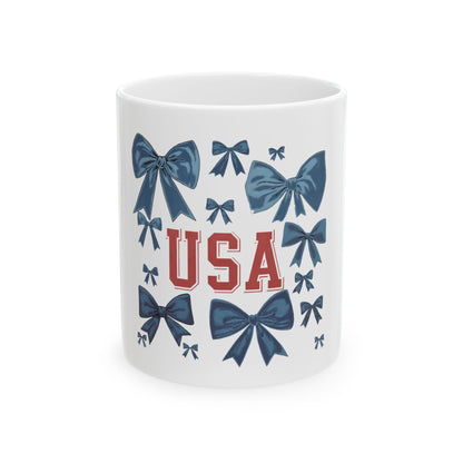 White mug with blue bows and red "USA" lettering.