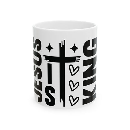 White mug with "Jesus King" text and a cross graphic.