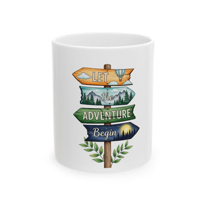 Directional signs with "Let the Adventure Begin" and nature illustrations on a white mug.