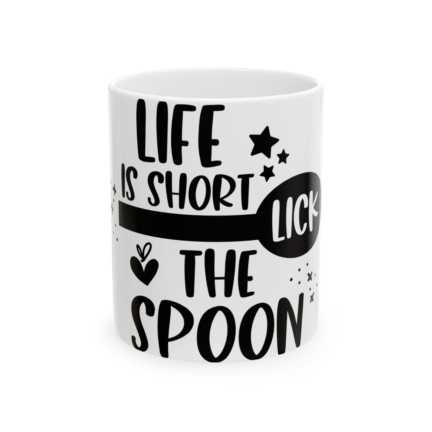 White mug with black text "LIFE IS SHORT LICK THE SPOON" and stars.
