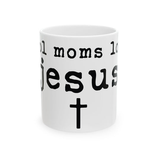 White mug with black text that reads "Cool moms love Jesus" and a cross.