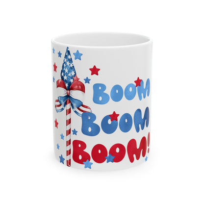 White mug with "Boom Boom Boom" text and patriotic USA flag design.