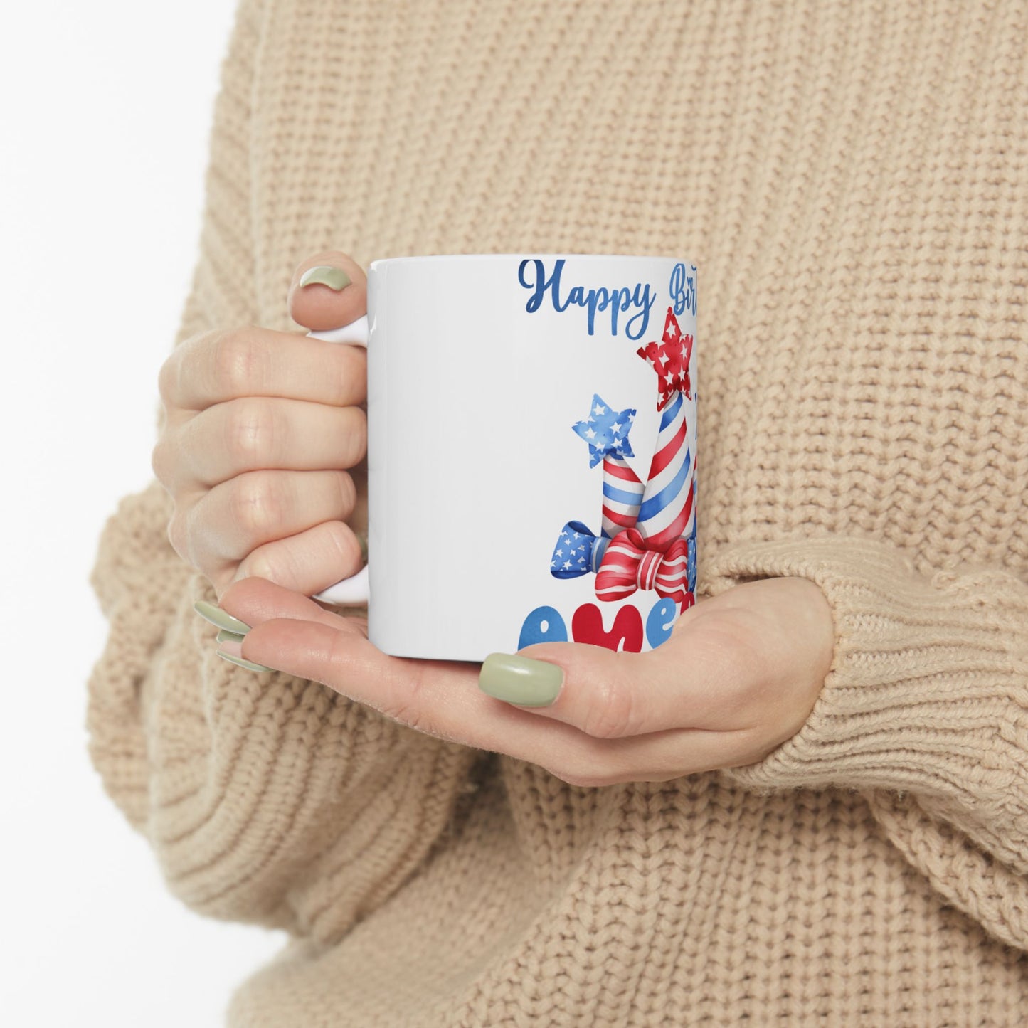 White mug with "Happy Birthday America" text and patriotic fireworks design.