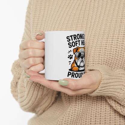 White mug with a bulldog wearing sunglasses and text "STRONG HEARTED PROUD".