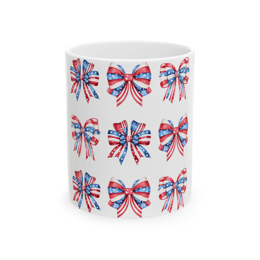 White mug with a repeating pattern of red, white, and blue patriotic bows.