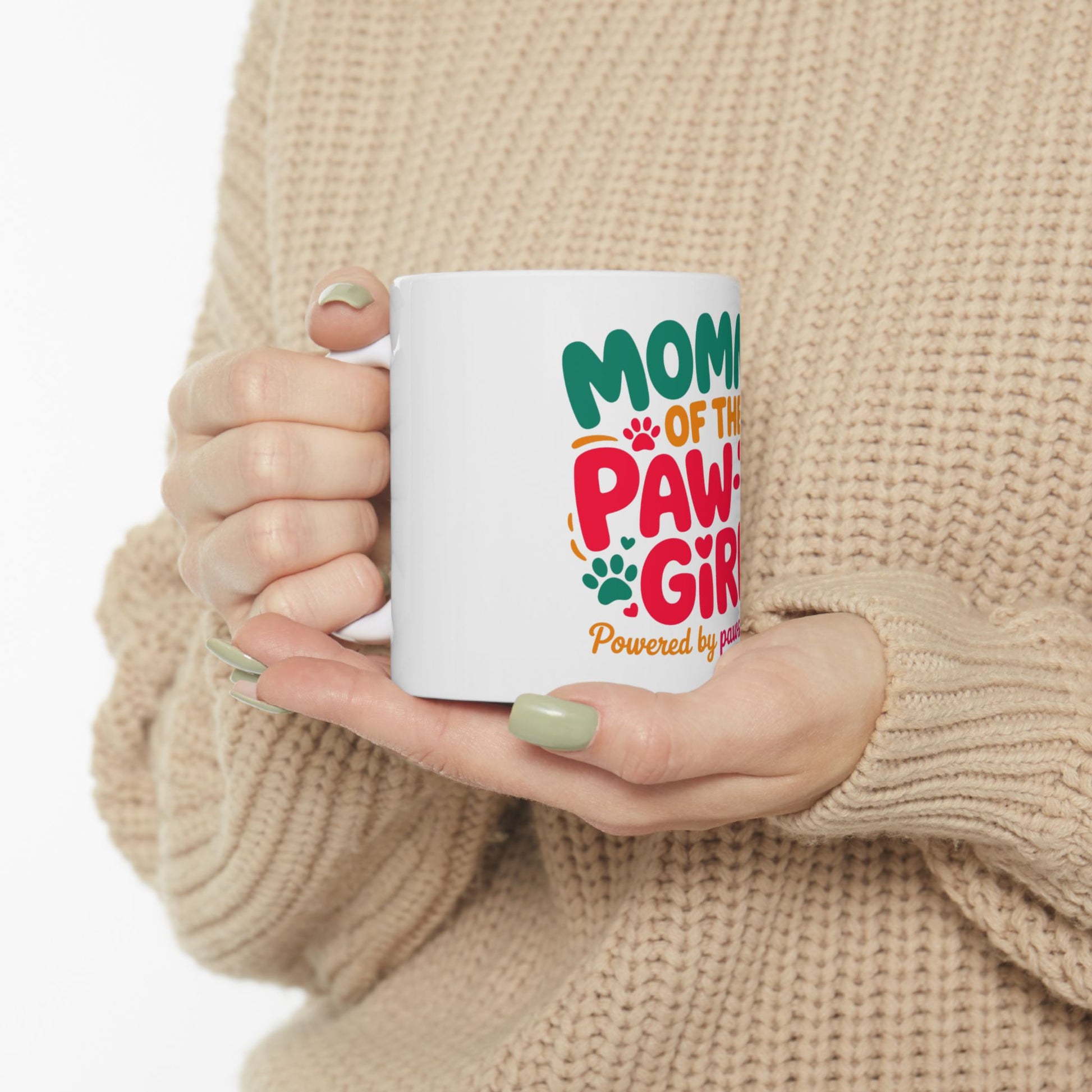 White mug with "Mom of the Paw-Powered Girl" text and paw prints.