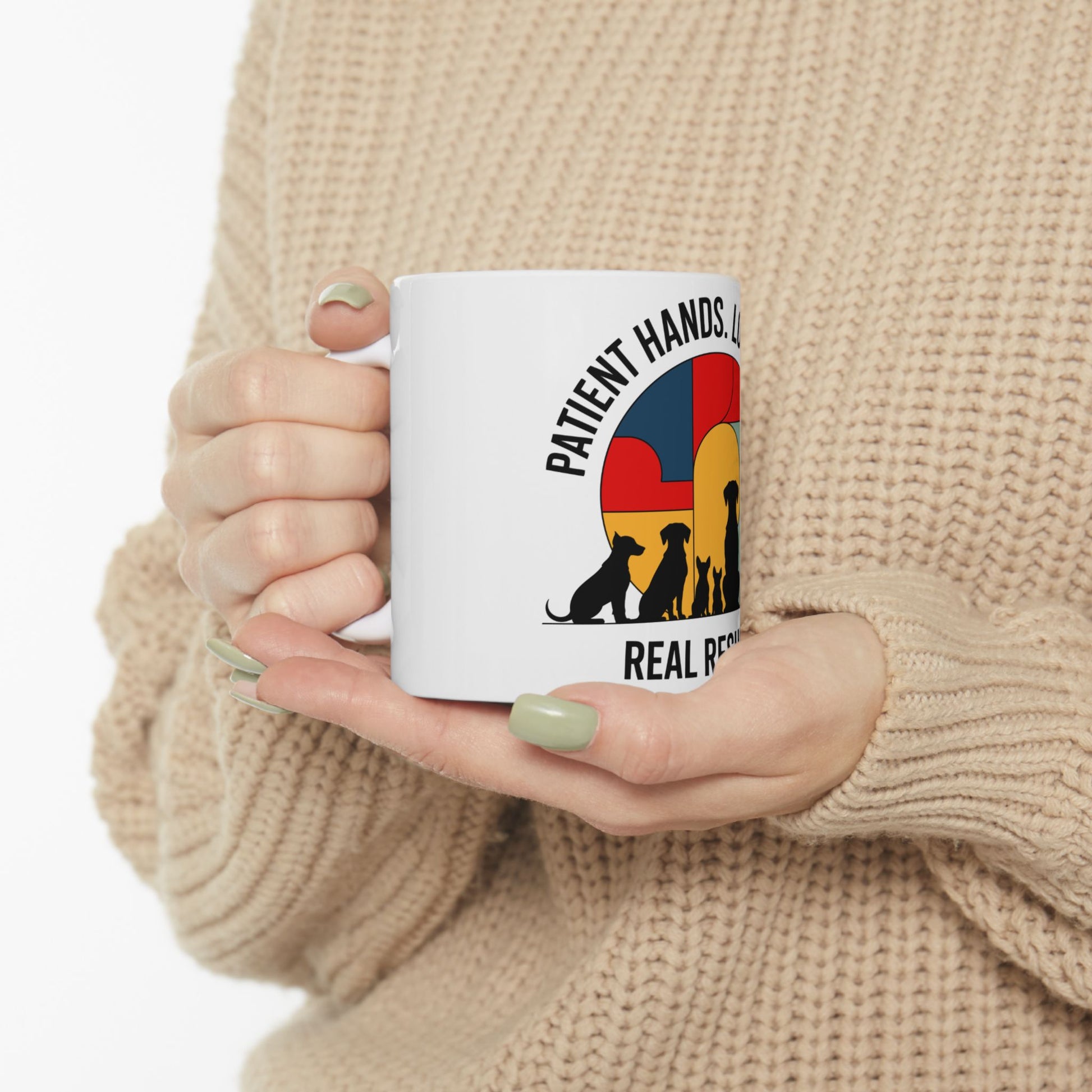 White mug with colorful animal silhouette logo and text.