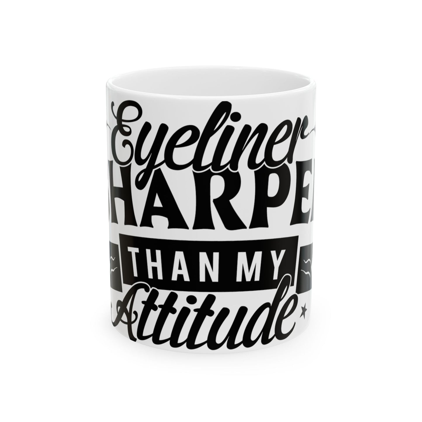 White mug with black text: "Eyeliner Sharper Than My Attitude"