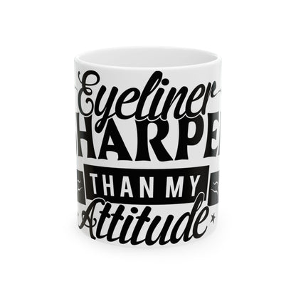White mug with black text: "Eyeliner Sharper Than My Attitude"