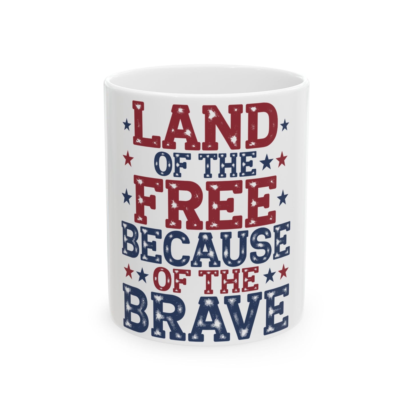 White mug with red and blue text: "LAND OF THE FREE BECAUSE OF THE BRAVE".
