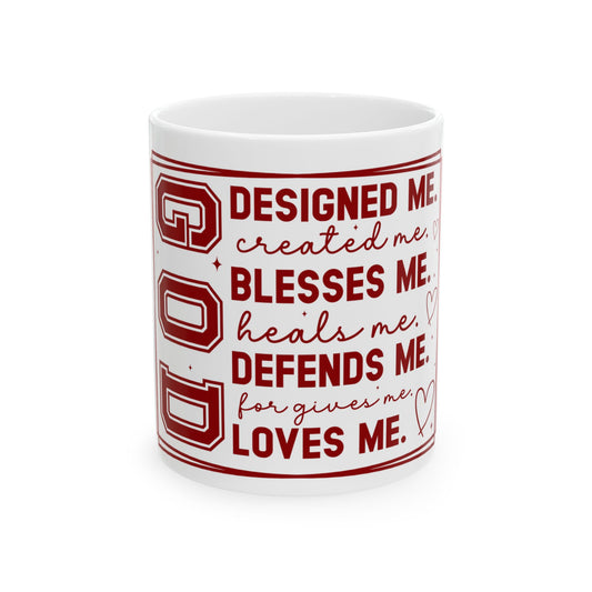White mug with text: God designed, created, blesses, defends, heals, forgives, loves me.