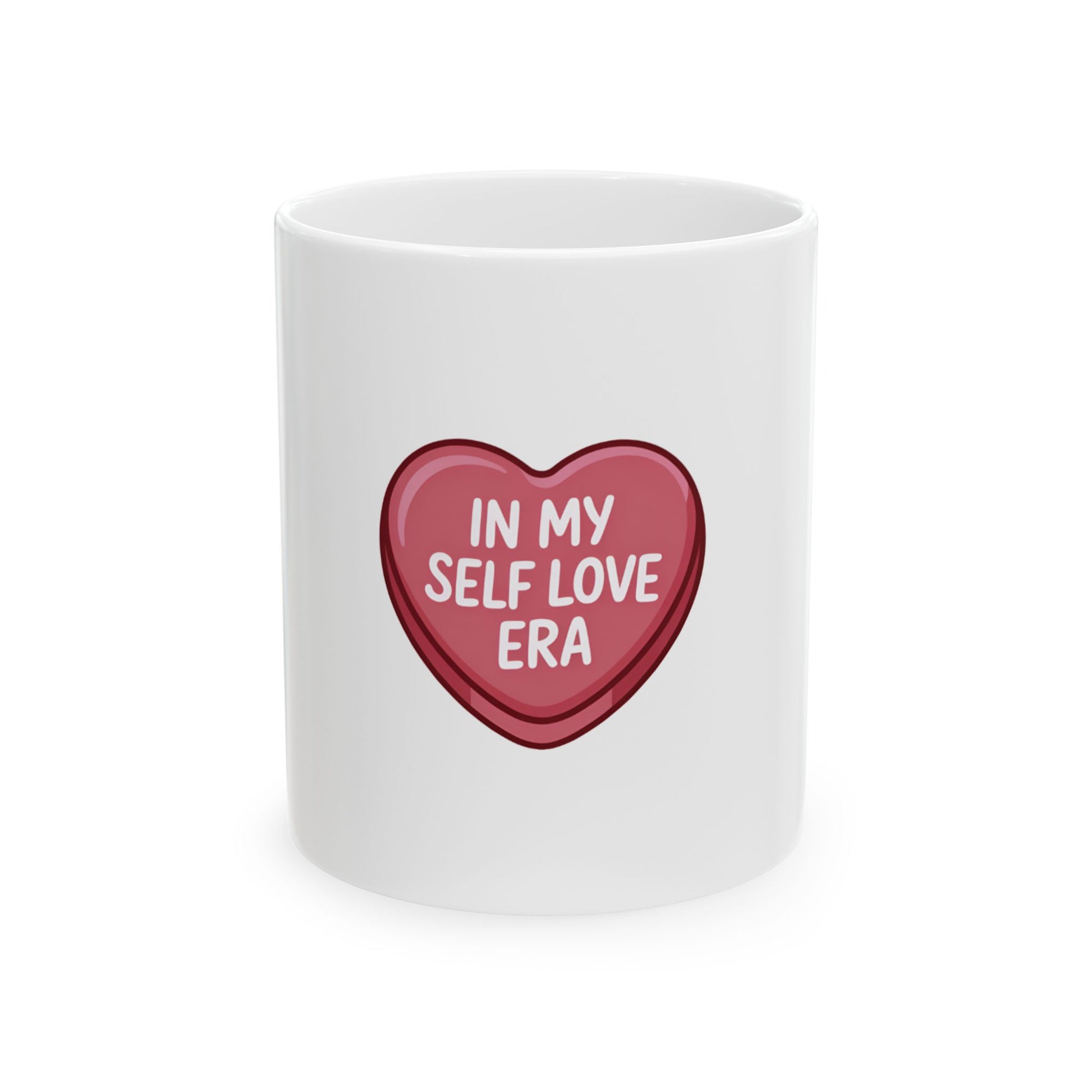 White mug with a pink heart design that says "In My Self Love Era".