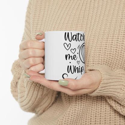 White mug with "Watch me whip" text and a heart and whisk graphic.