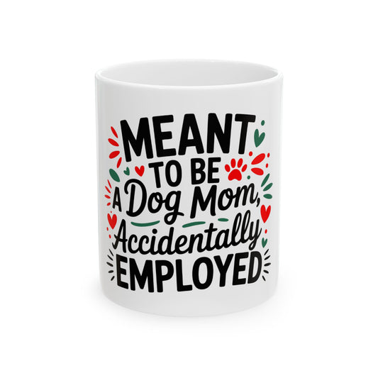 White mug with "Meant to be a Dog Mom, Accidentally Employed" text and paw prints.