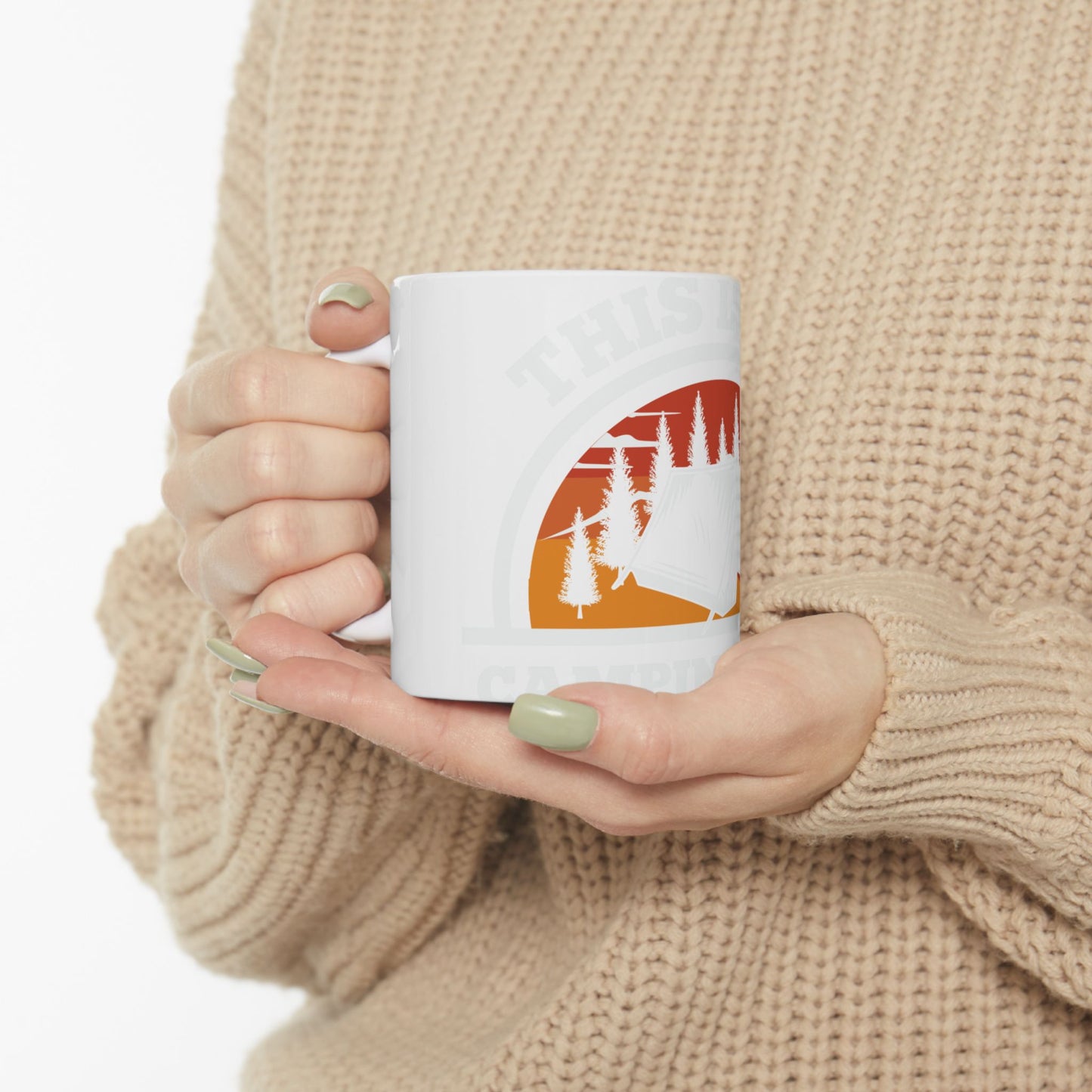 White mug with "THIS IS CAMPING" text and a sunset scene.