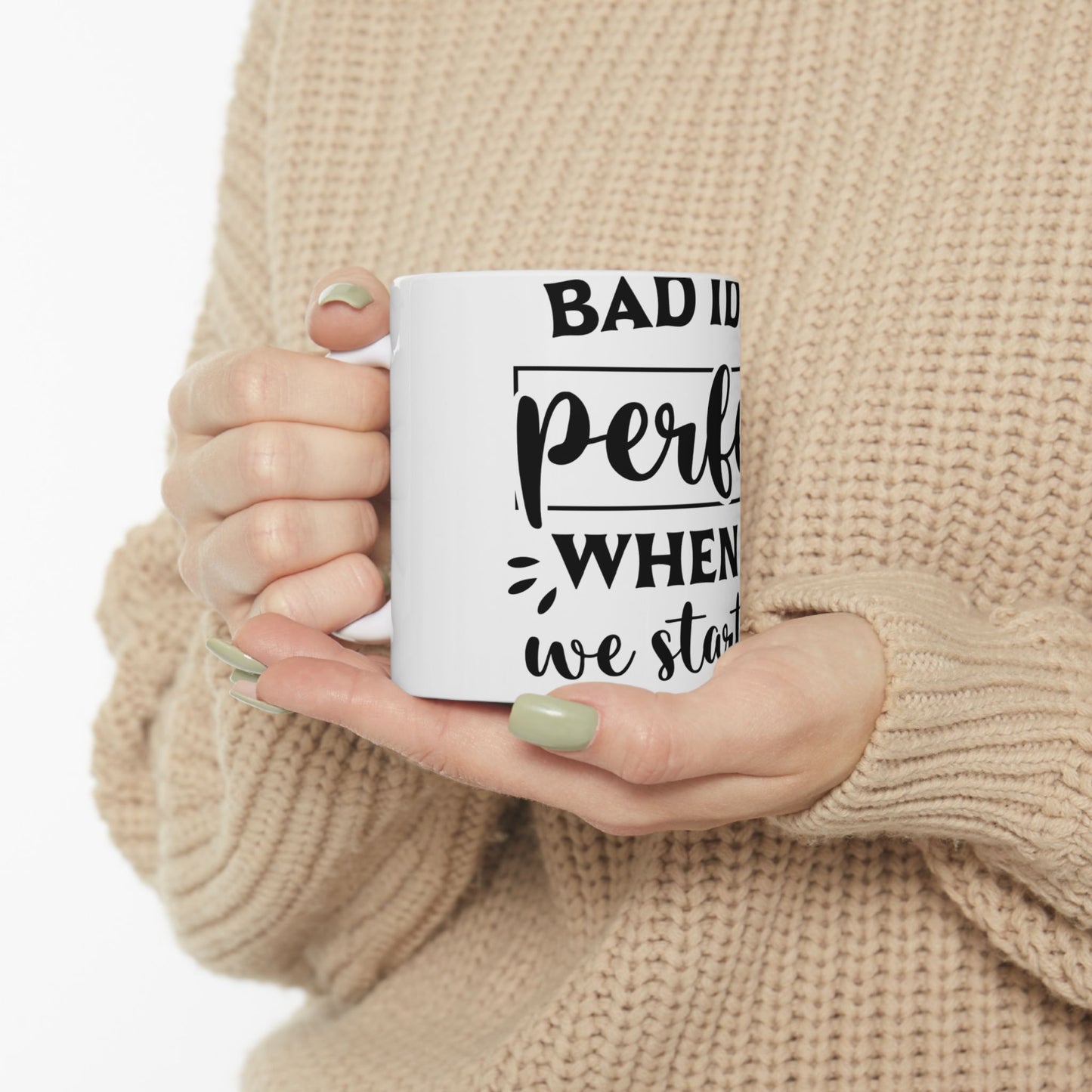 White mug with black text "BAD ID per when we start".
