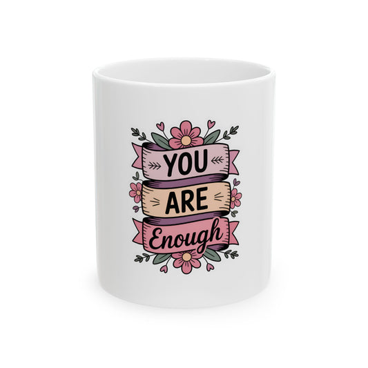 White mug with "YOU ARE Enough" message and floral embellishments.