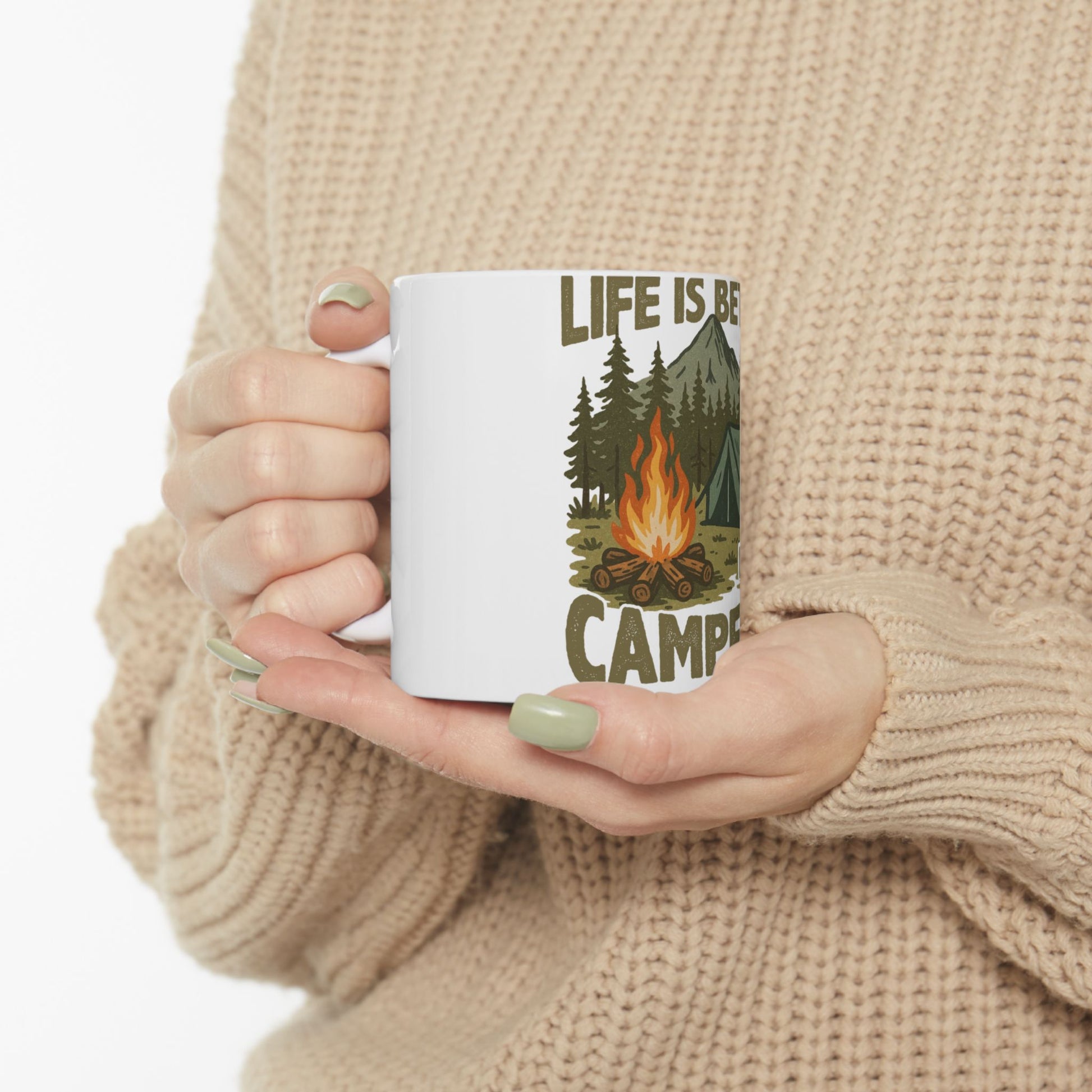 White mug with "LIFE IS BE CAMP" text, featuring a campfire and tent illustration.